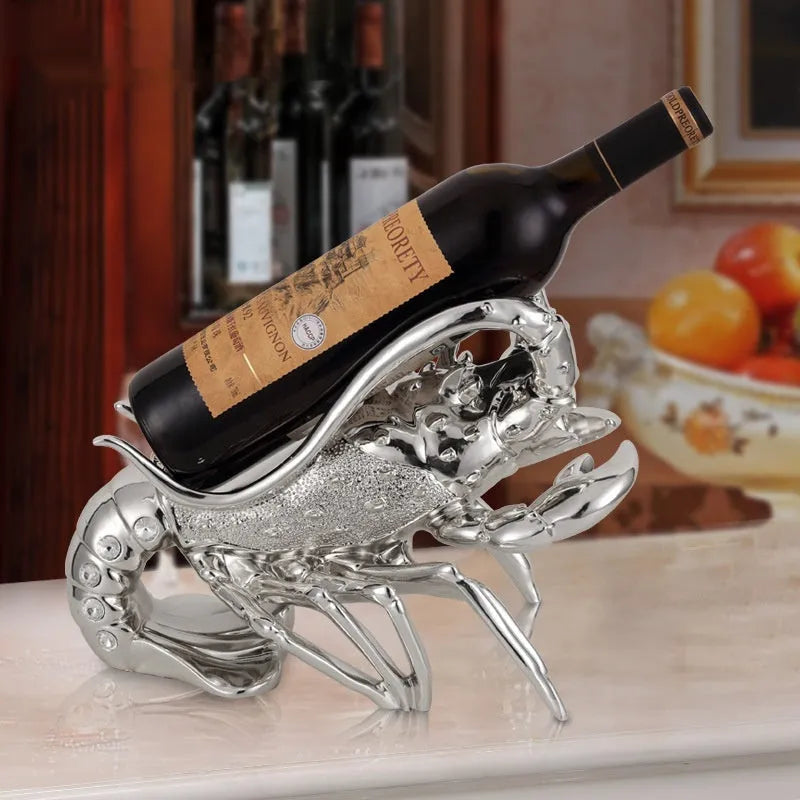 Lobster-shaped wine rack ornament in metallic finish displaying wine bottle