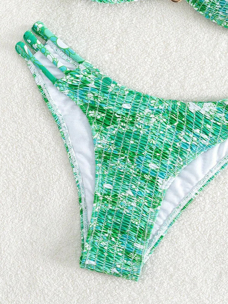 Women's high-waist floral bikini swimsuit on a hanger in blue, orange, pink, and rose red colours.