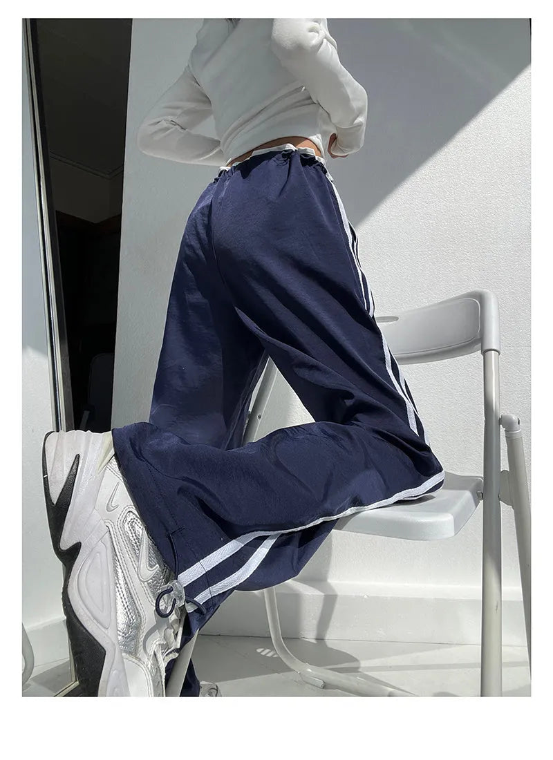 Women's navy blue loose straight trousers with white ribbon parallel bar waistband detail