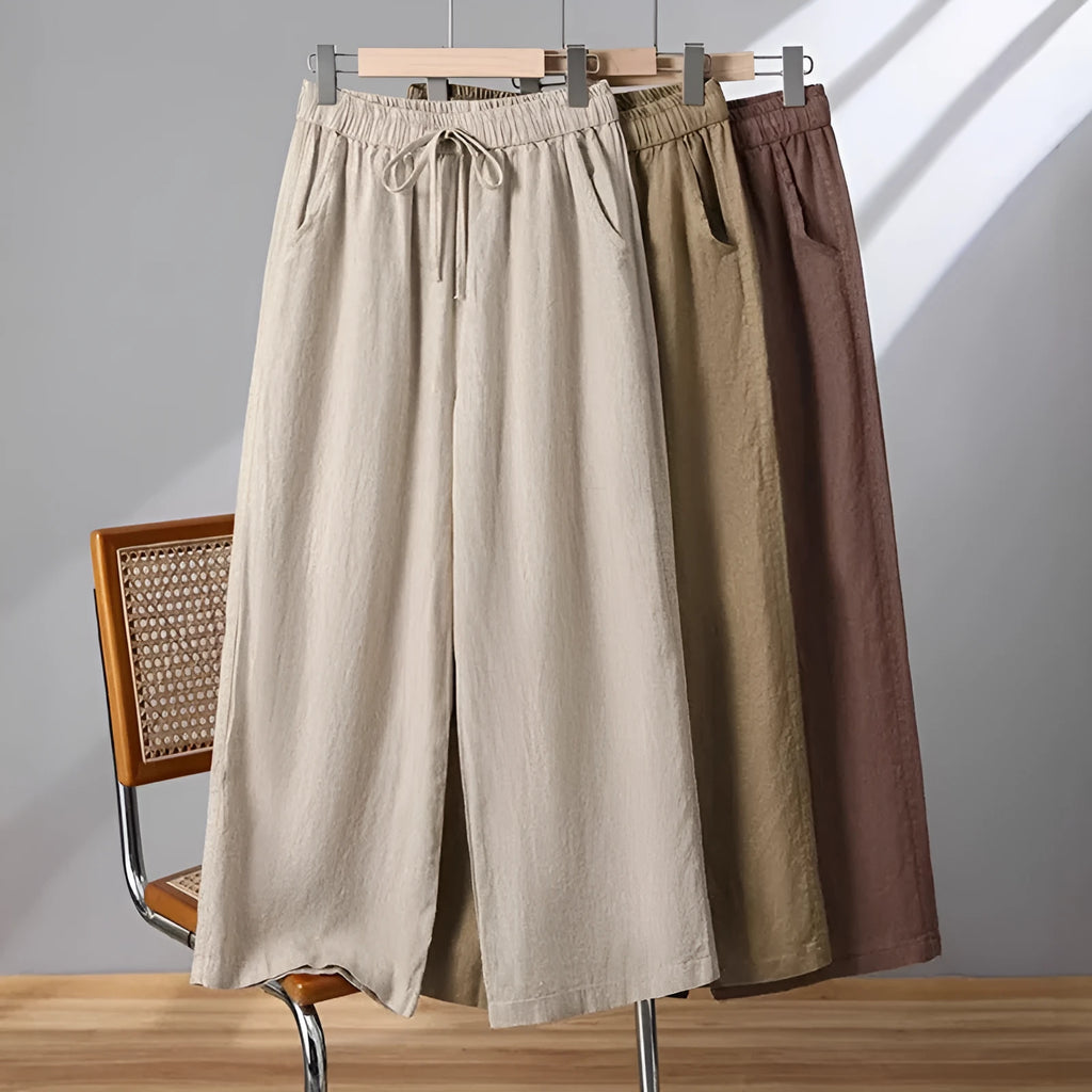 Women's straight-leg casual trousers in apricot colour with elastic and lace-up drawstring waistband.