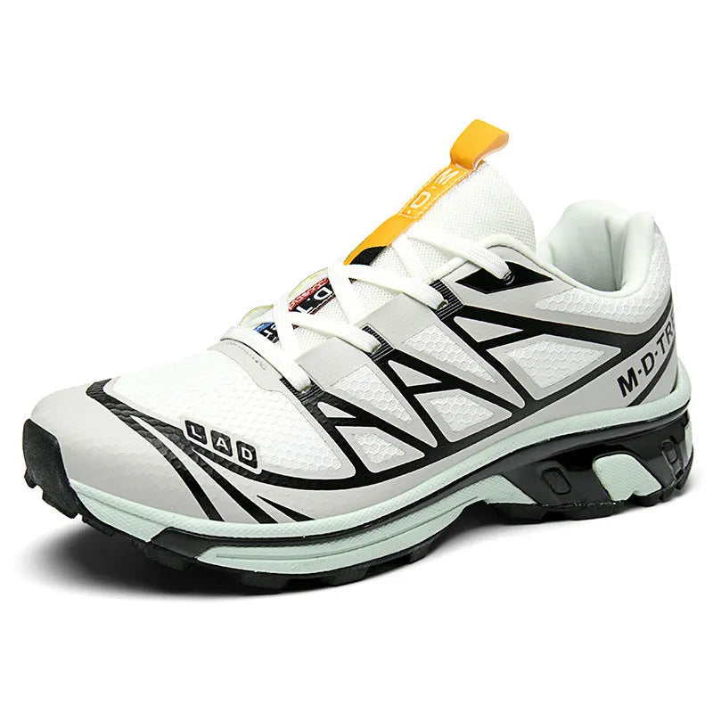 Low-top hiking shoes in khaki with rubber soles and front lace-up closure.