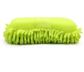 Silver green rectangular car wash sponge block on a clean surface