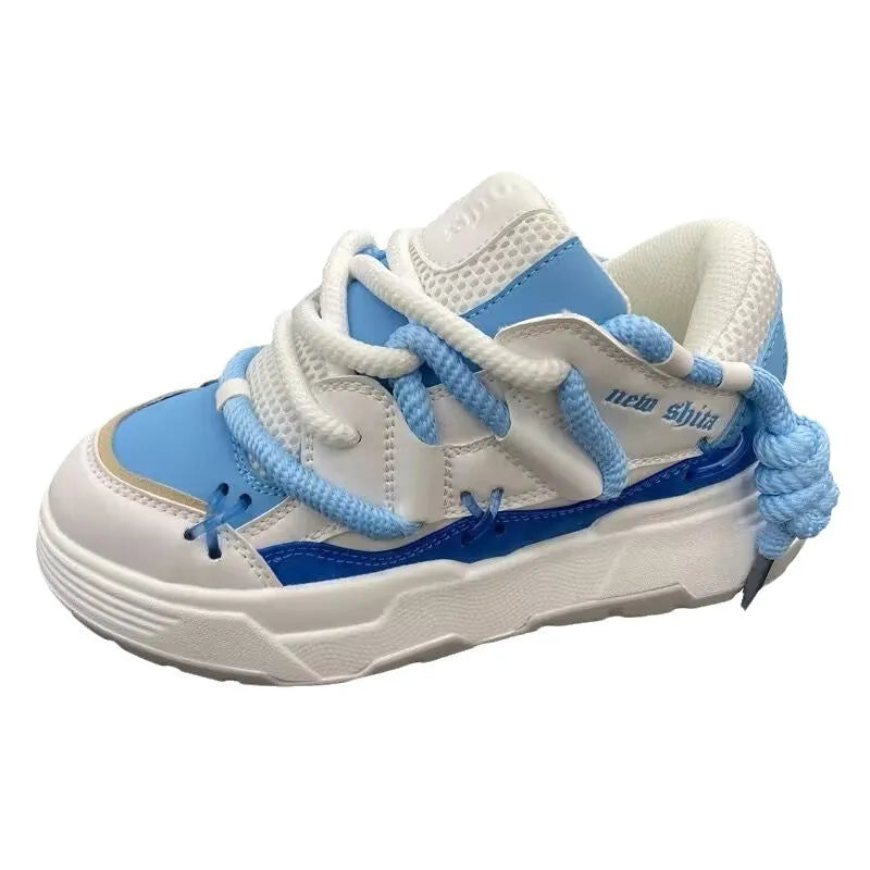 Women's thick bottom grey retro clunky sneakers with high heel on a white background.