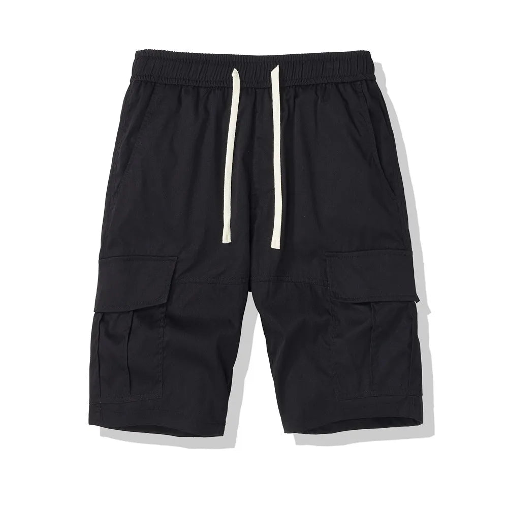 Man wearing loose black cropped trousers with multiple pockets for outdoor leisure.