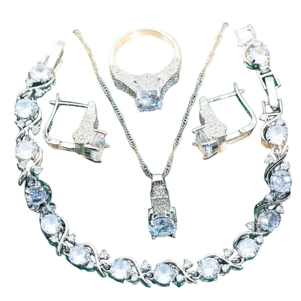 Four-piece bridal jewellery set with necklace, bracelet, earrings, and ring in alloy with zircon detail
