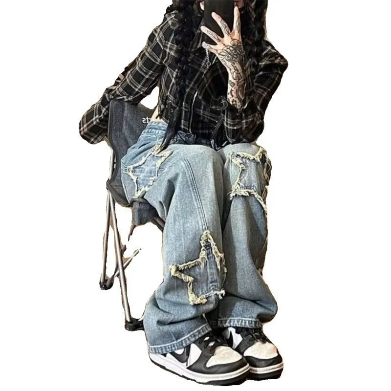 Blue high-waisted wide-leg denim trousers with straight-leg design on hanger