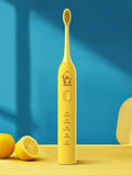 Small yellow duck electric toothbrush with soft bristles and USB charging in green pink and yellow colours