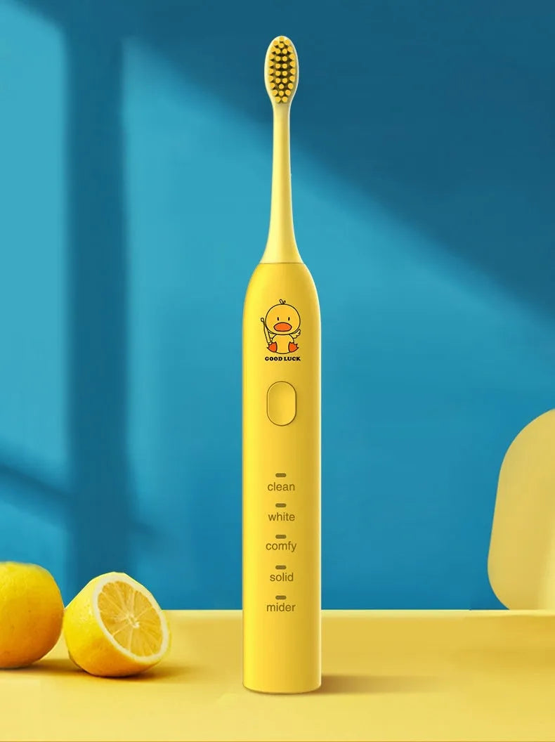 Small yellow duck electric toothbrush with soft bristles and USB charging in green pink and yellow colours