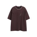 Purple loose-fit cotton t-shirt with embroidered detailing and a washed retro look on a hanger.