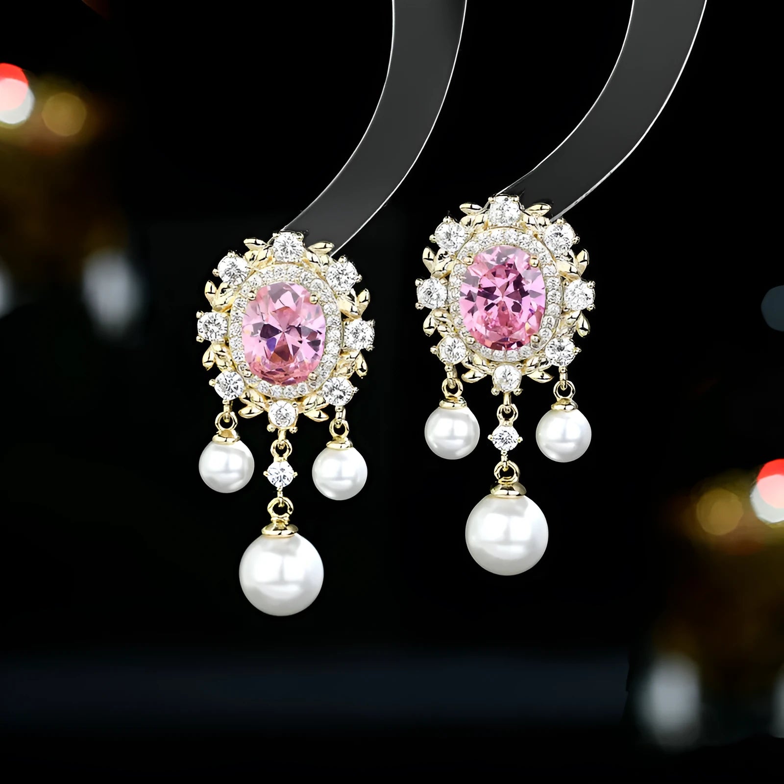 Oval-shaped copper earrings with zircon-inlaid pearls and long decorative tassels in light purple.