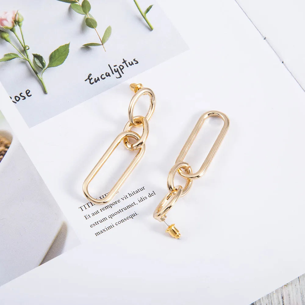 Geometric sterling silver needle hoop earrings with ring and line design in alloy metal