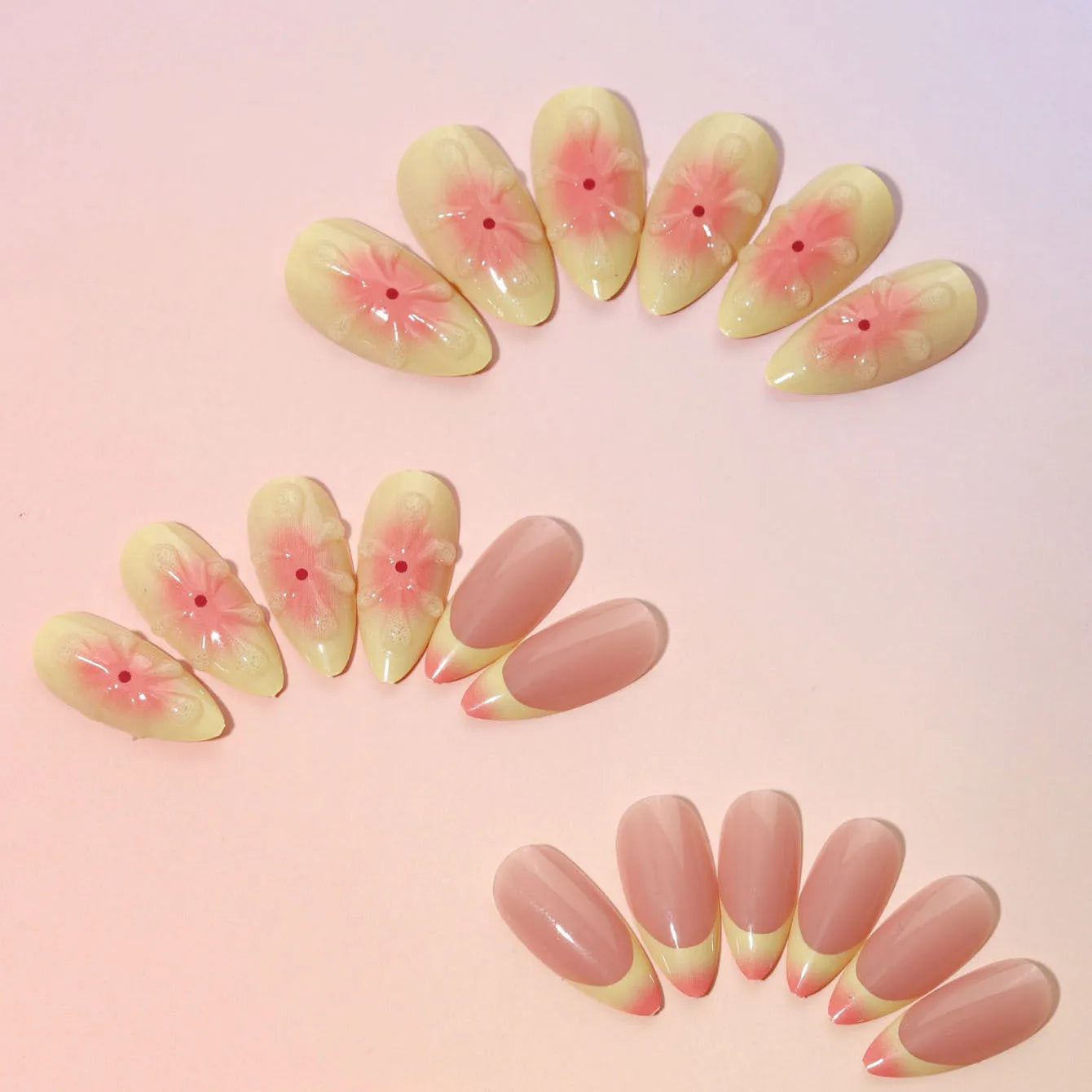 Set of pink cartoon flower fake nails with wearable armour, jelly glue, and file on a white background.