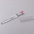 A reusable silicone lip brush with a handle and protective cap, shown in one of eight available colours.