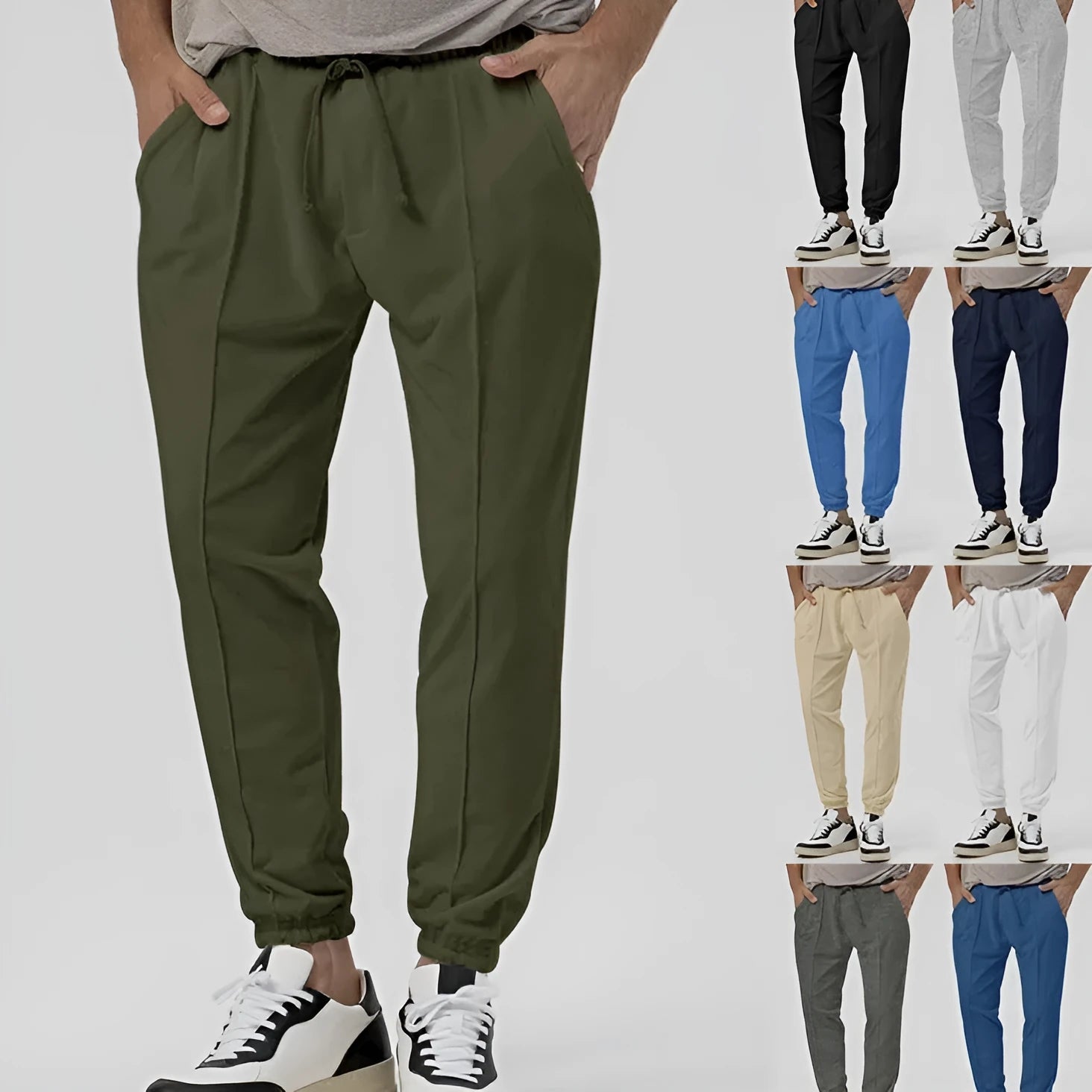 Men's grey loose-fit tapered track sweatpants with a straight leg on a neutral background.
