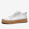Men's black casual leather shoes with round toe and lanyard closure on soft rubber soles
