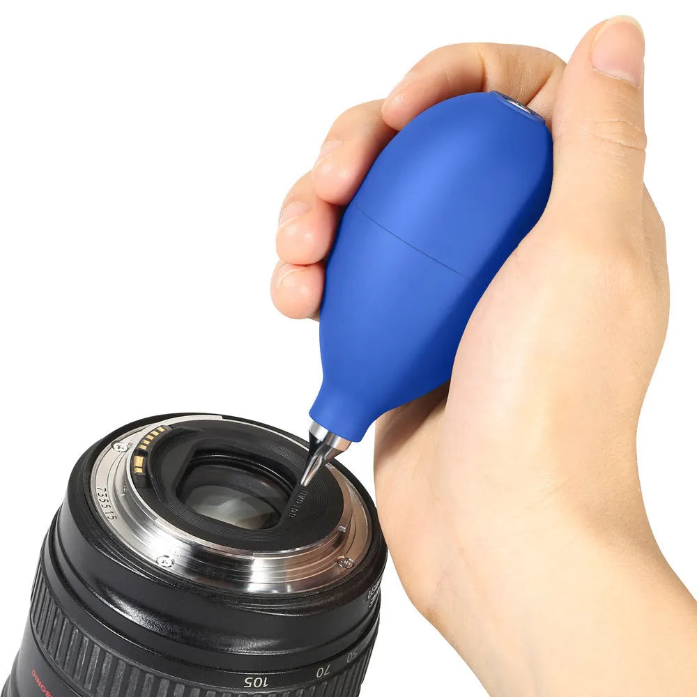 Blue rubber handheld dust blower cleaning tool for camera lenses and phones.