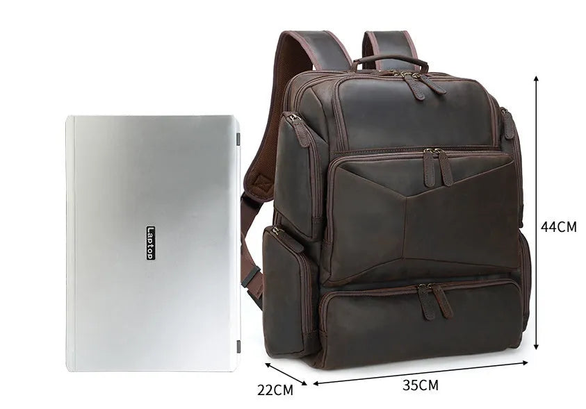 Dark brown genuine leather 17-inch laptop backpack with double shoulder straps and embossed finish