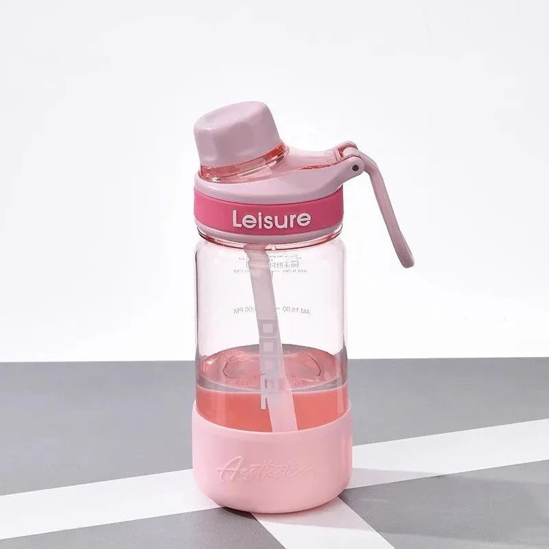 Grey cartoon patterned plastic cup with built-in straw showing 1000ml capacity marking