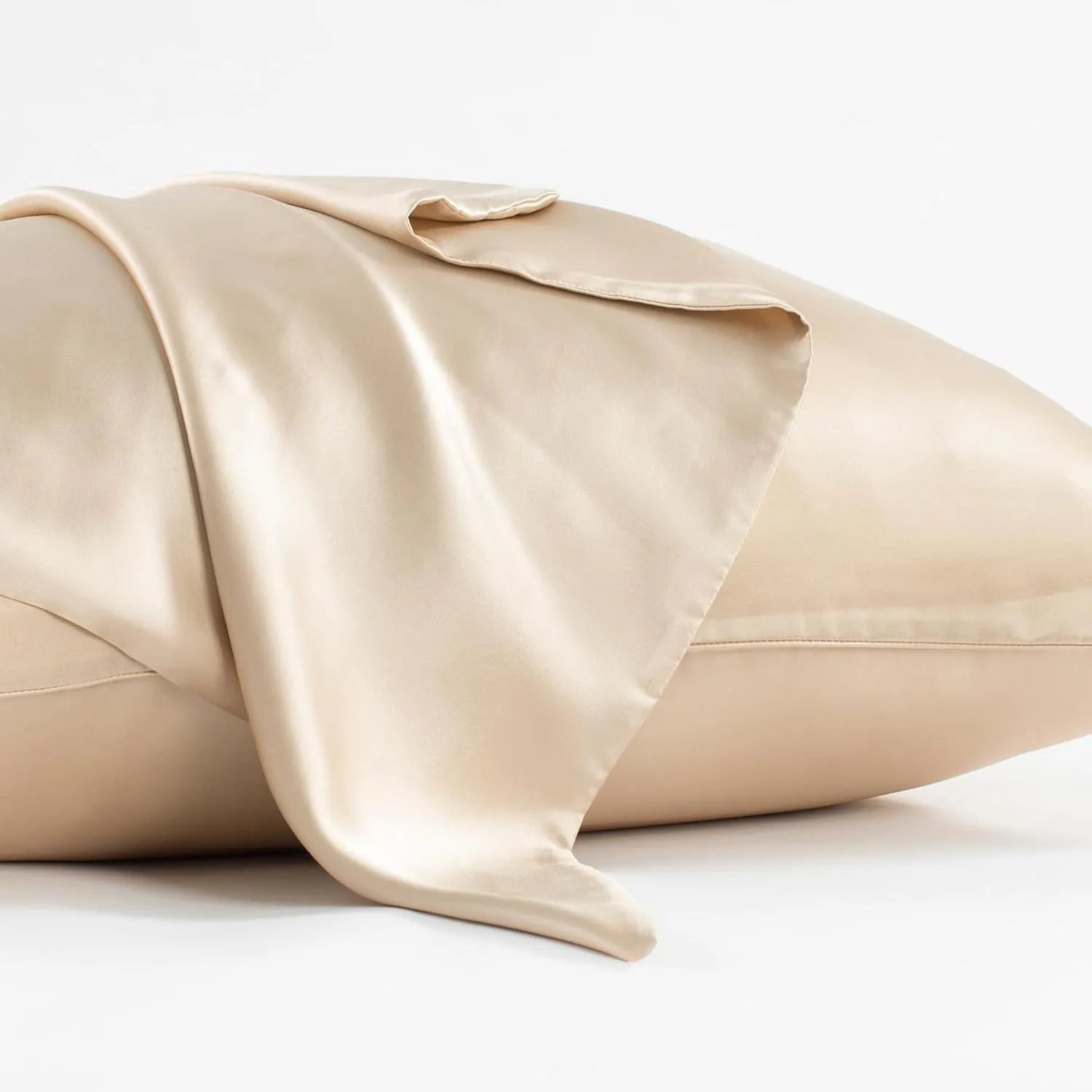 Dark grey 19 M mulberry silk pillowcase with envelope closure on a bed.