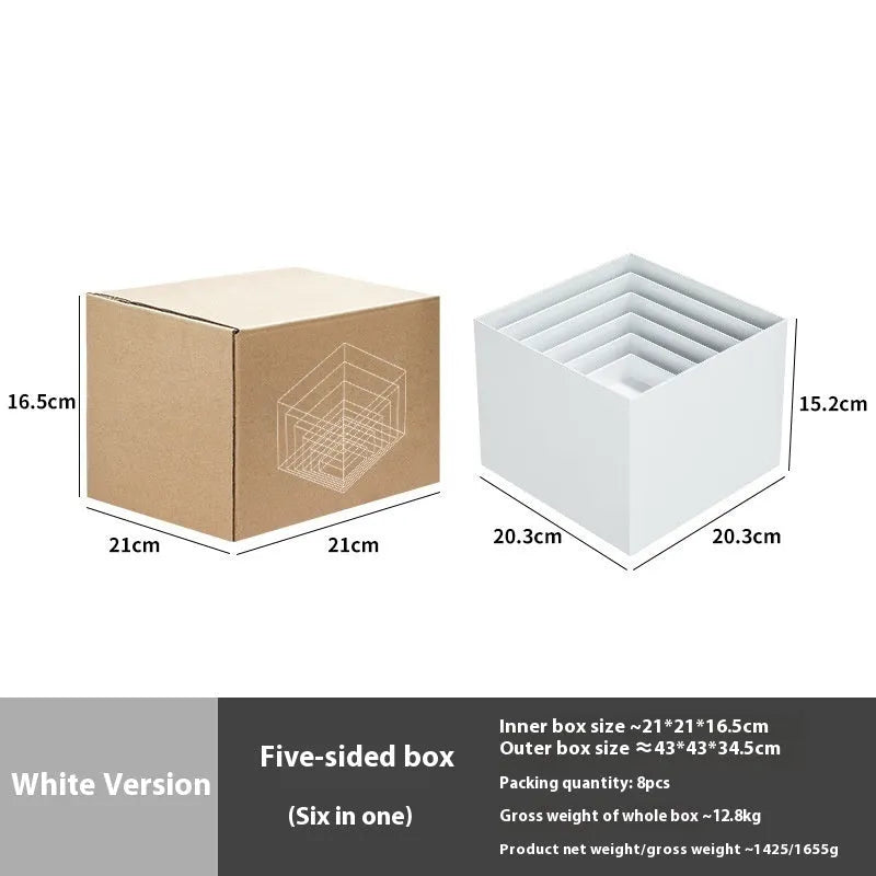 White plastic cube dessert display stand with six modular pieces arranged on tabletop