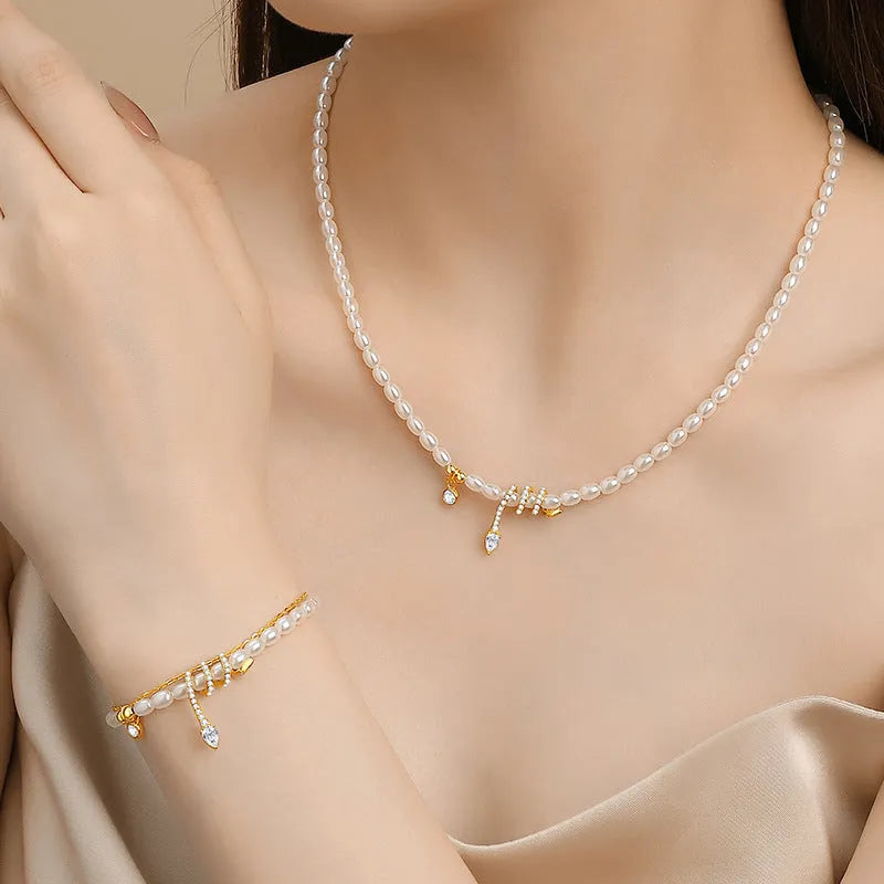 Pearl snake bracelet in 925 silver with electroplated gold or white gold colour on a wrist.
