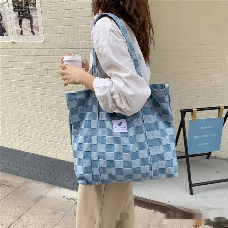 Large capacity Oxford cloth shoulder bag for women with a three-dimensional front pocket.