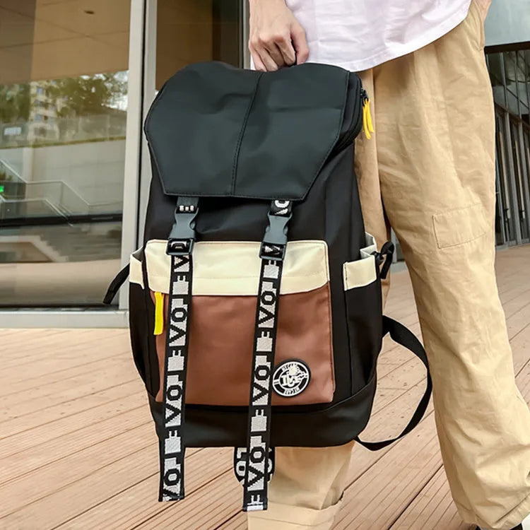 Oxford cloth backpack shown in black, green, or red, featuring multiple carry handles and straps.