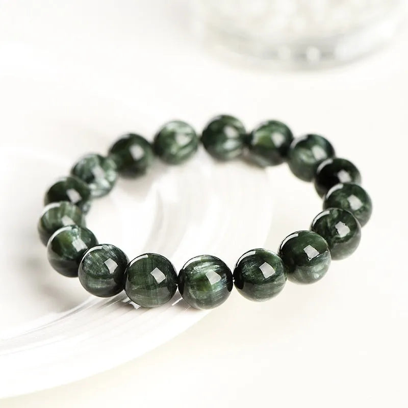Green Dragon Crystal bracelet with 8-9mm round beads featuring geometric Ruyi design elements
