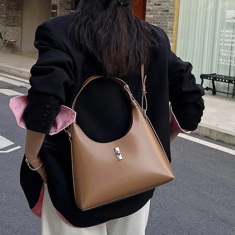 Genuine leather dumpling-shaped crossbody bag with multiple compartments in apricot colour