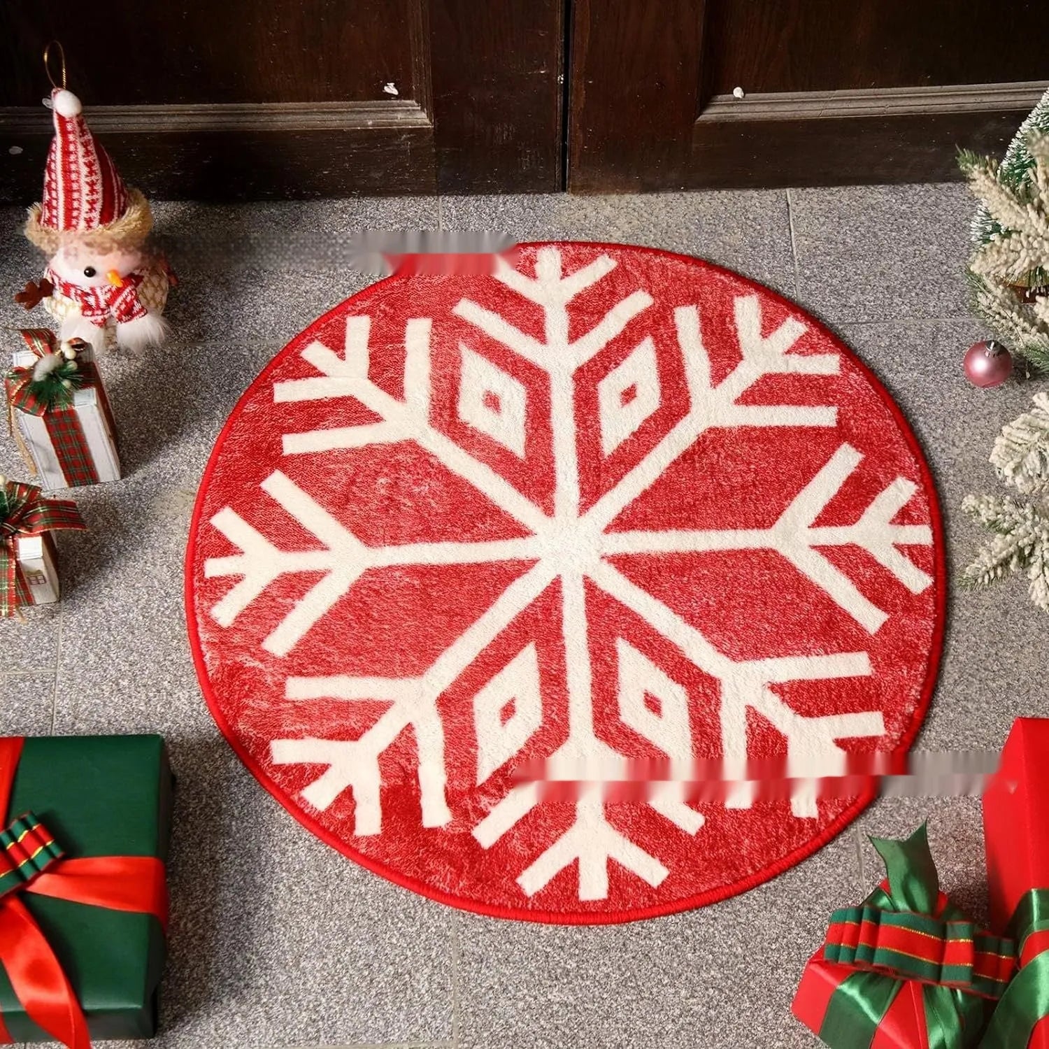 Round printed Christmas carpet on floor in festive red and green pattern.