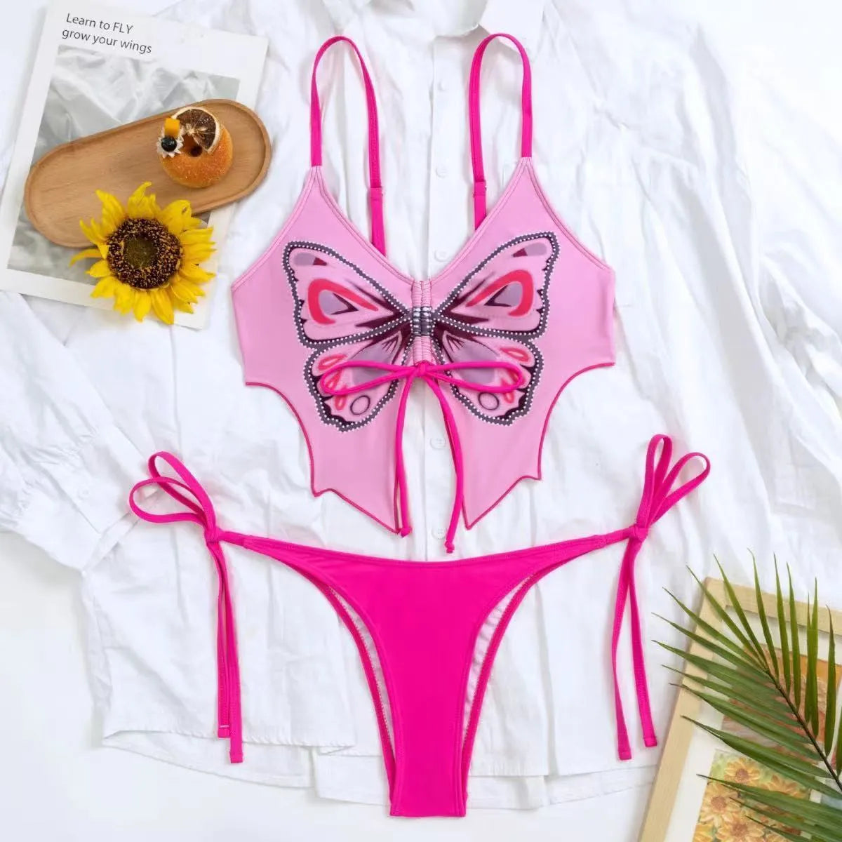 Women's purple split bow back bikini swimsuit set on mannequin, showing sleeveless top and briefs.