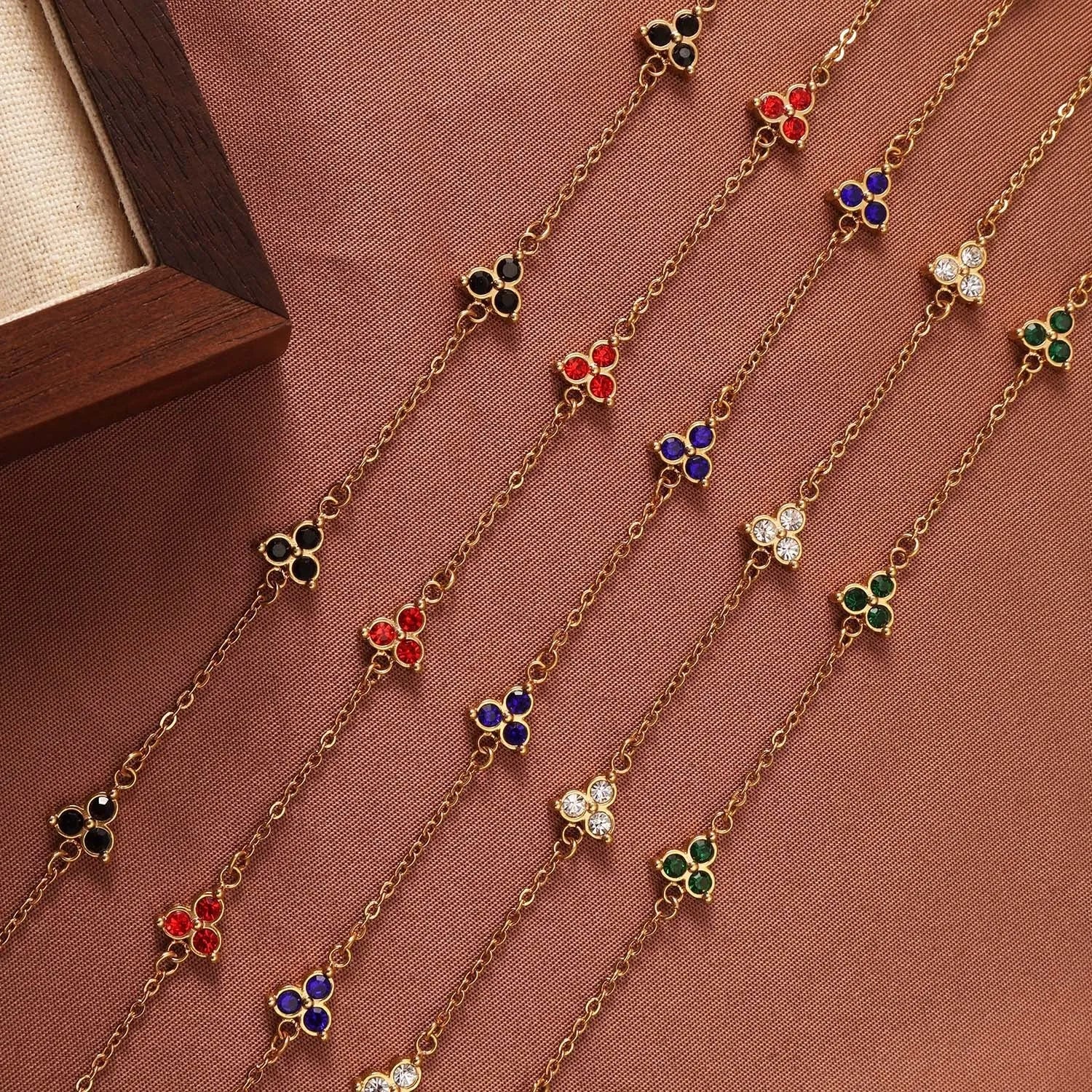 Women's geometric bracelet with triangular diamond cluster in gold or steel stainless steel with coloured stones