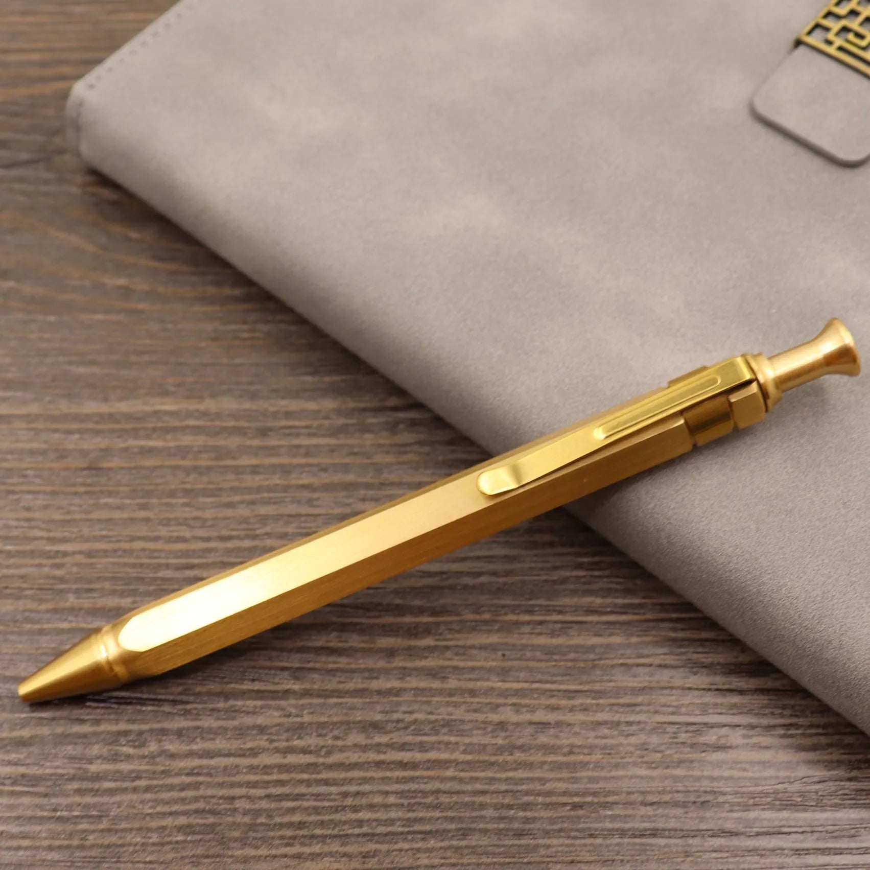 Brass tactical pen with bolt-action mechanism and retro brushed finish