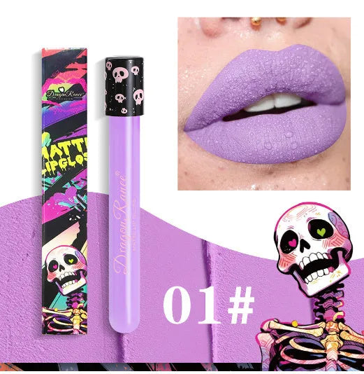 Halloween creative makeup lip gloss in skull-shaped test tube packaging, showing a matte gold and silver finish.