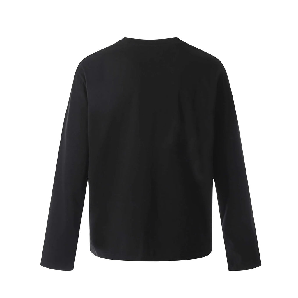 A man's loose-fit black cotton pullover T-shirt with long sleeves in a casual retro style.