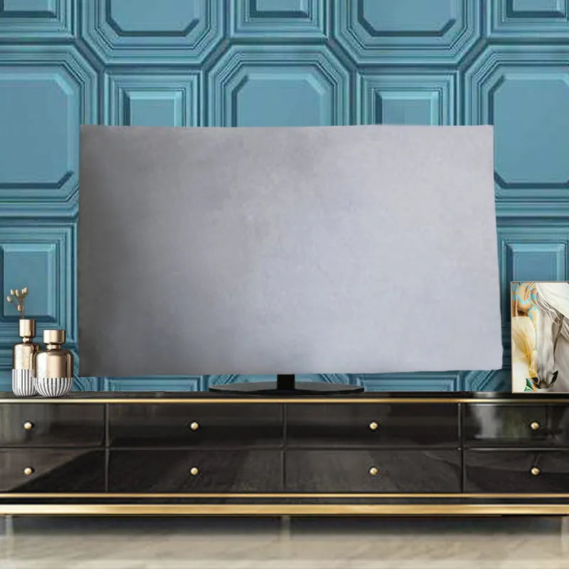 Pink velvet fabric cover draped over a large flat-screen television.