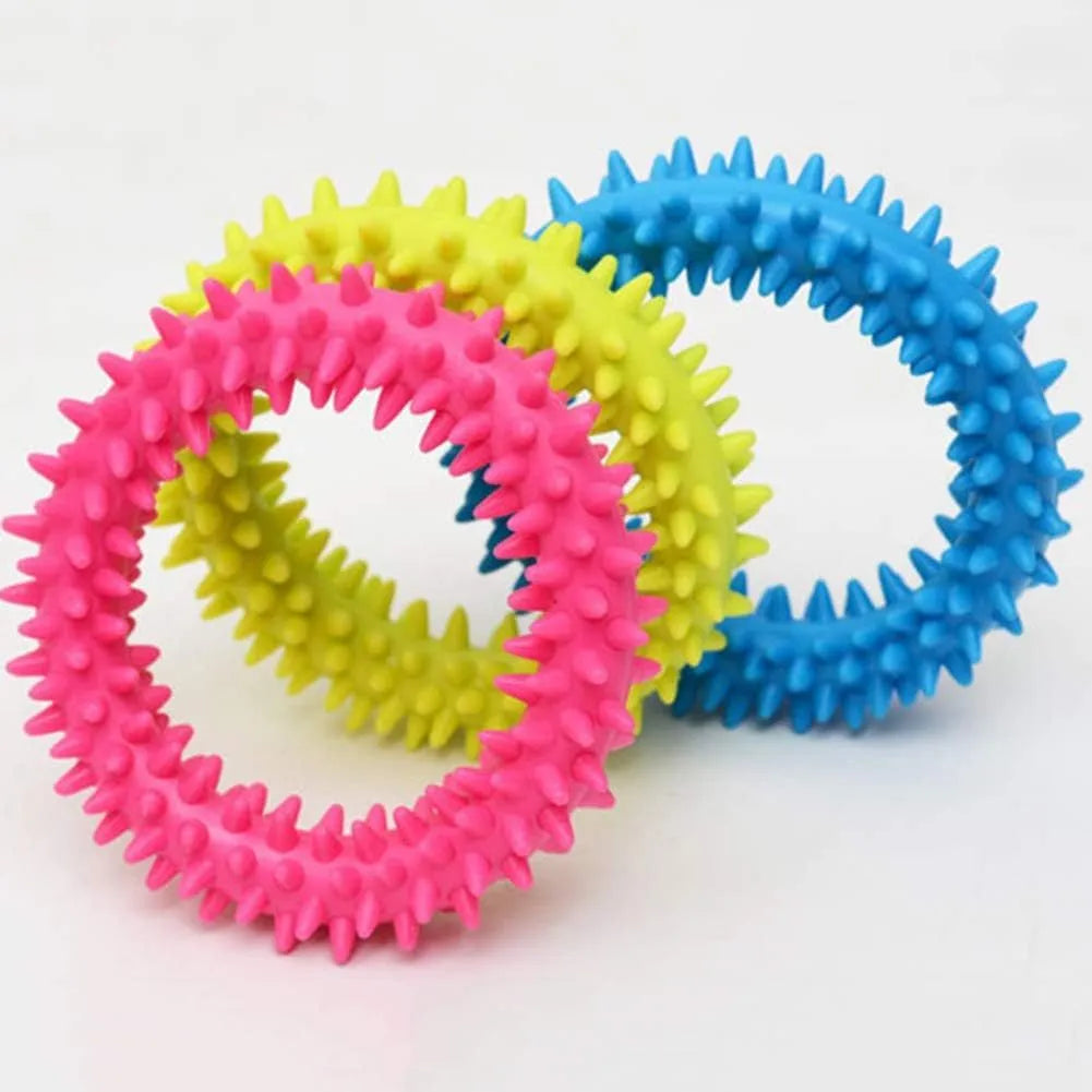 Blue TPR spiky ring dog chew toy with dental cleaning nubs on a white background