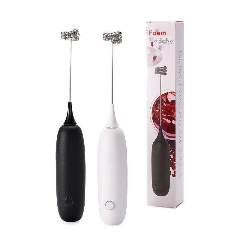 Handheld electric milk frother in black and white colours for making coffee and hot chocolate foam.