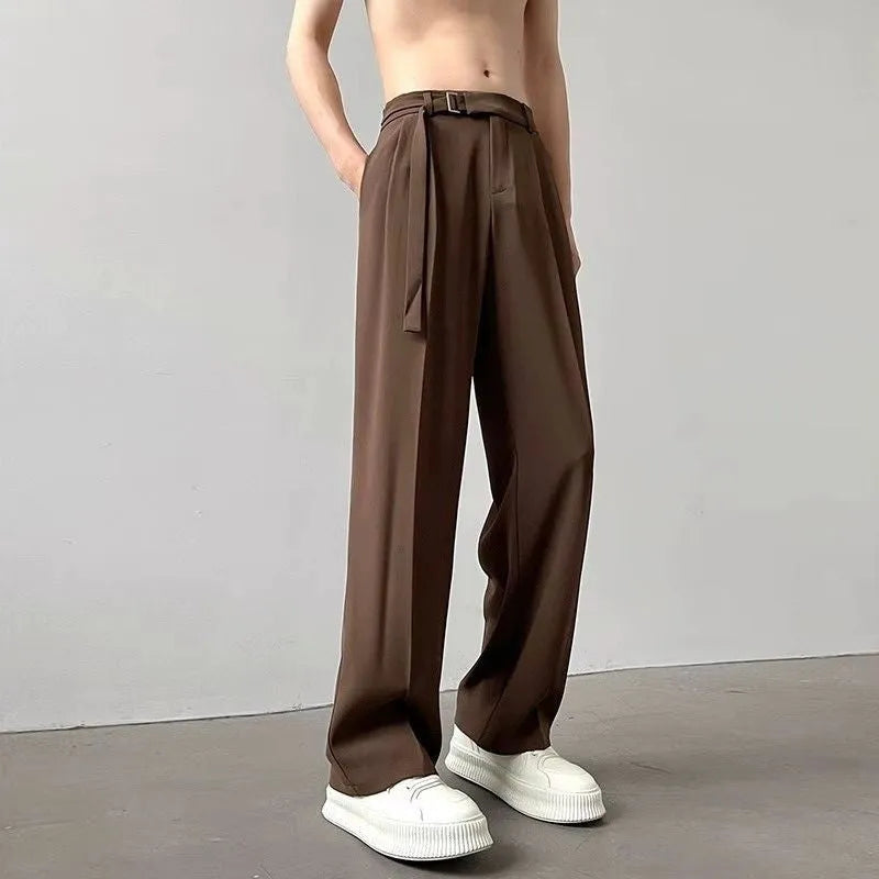 Black straight leg wide trousers on hanger showing loose fit and non-ironing fabric