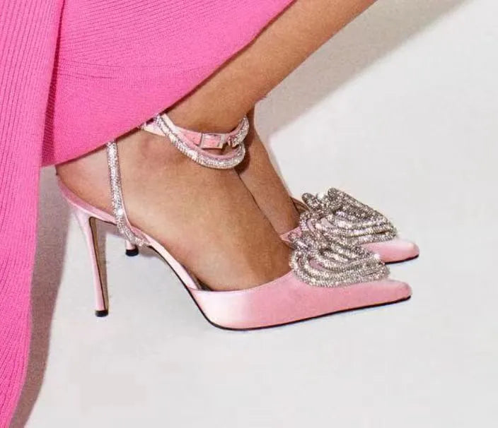 Women's pink satin sandal with heart-shaped rhinestone decoration and pointed toe.
