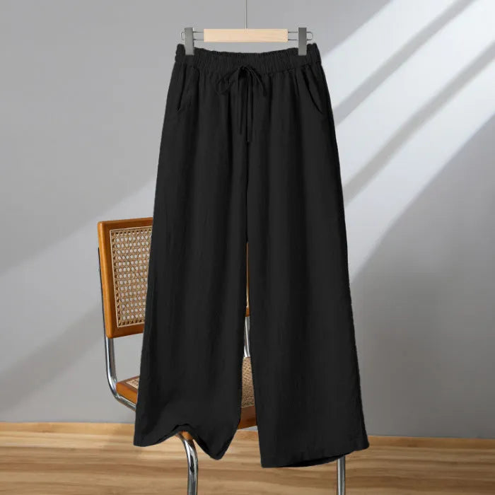 Women's straight-leg casual trousers in apricot colour with elastic and lace-up drawstring waistband.