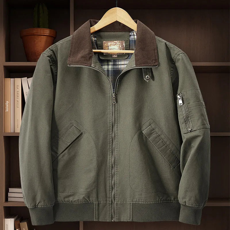 Men's plus-size washed cotton baseball flight jacket in army green, shown on a hanger.