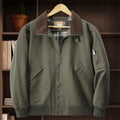 Men's plus-size washed cotton baseball flight jacket in army green, shown on a hanger.