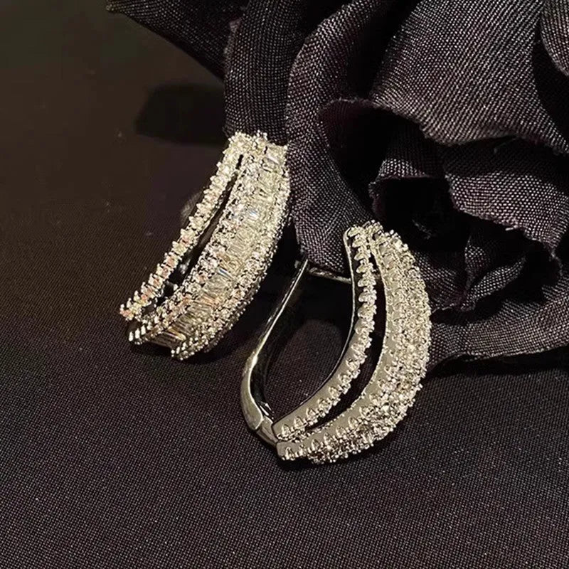 Geometric copper stud earrings with inlaid zircon stones in white gold colour