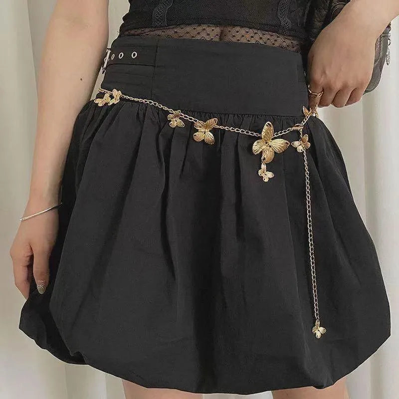 Gold butterfly waist chain with 104cm length and 40cm width on mannequin