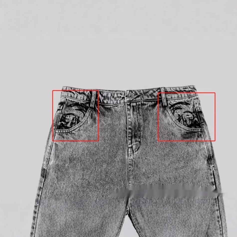 Grey loose-fitting straight-leg cotton denim trousers for men and women on a hanger
