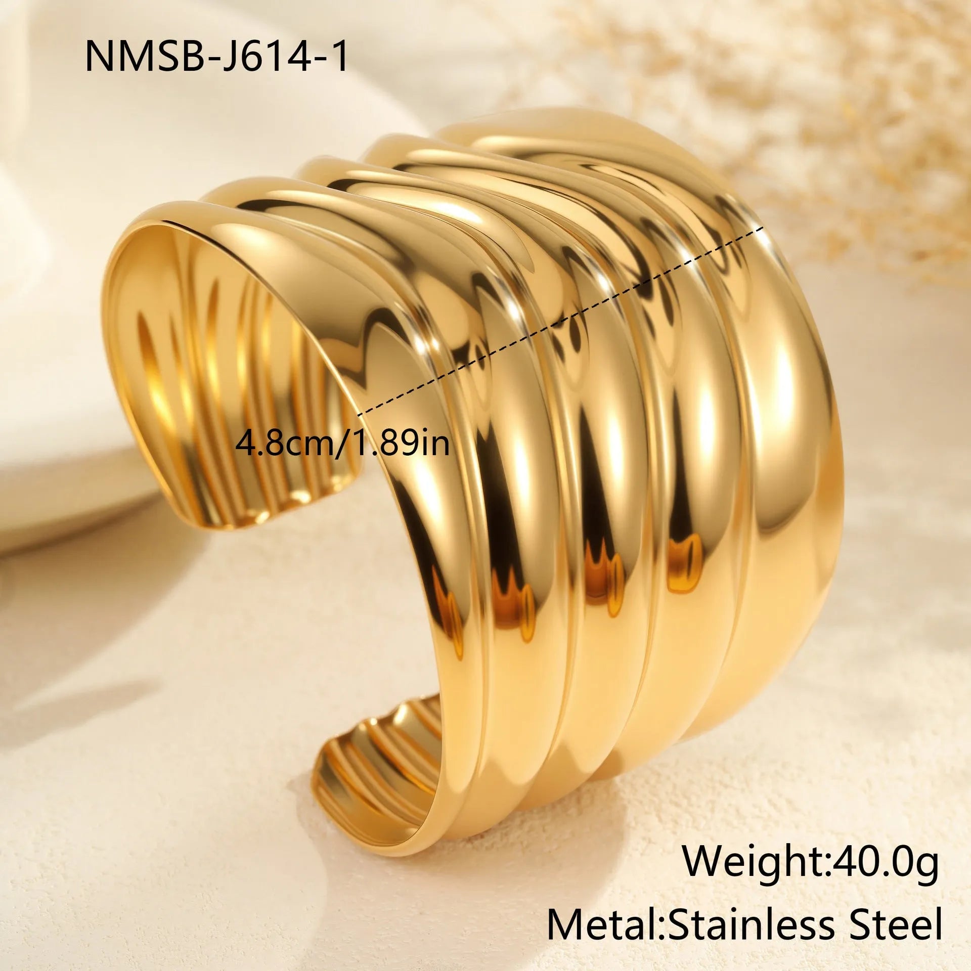 Women's exaggerated wide stainless steel bracelet with 18K gold plating and geometric wave design