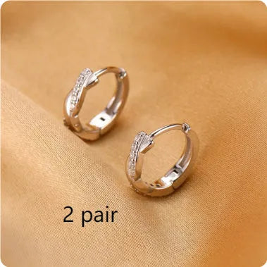 Geometric interwoven hemp rope earrings in copper with gold finish and earclip fastening