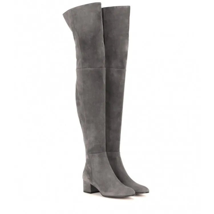 Women's grey suede over the knee flat boots with a pointed toe and low thick rubber sole.