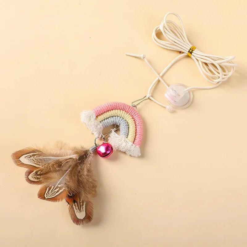 Blue feather cat rope toy hanging from a door with elastic swing and sticky buckle clamp